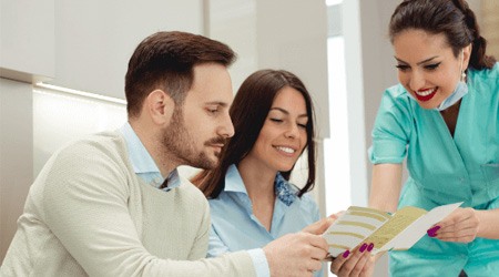 Person calculating what dental insurance plans cover